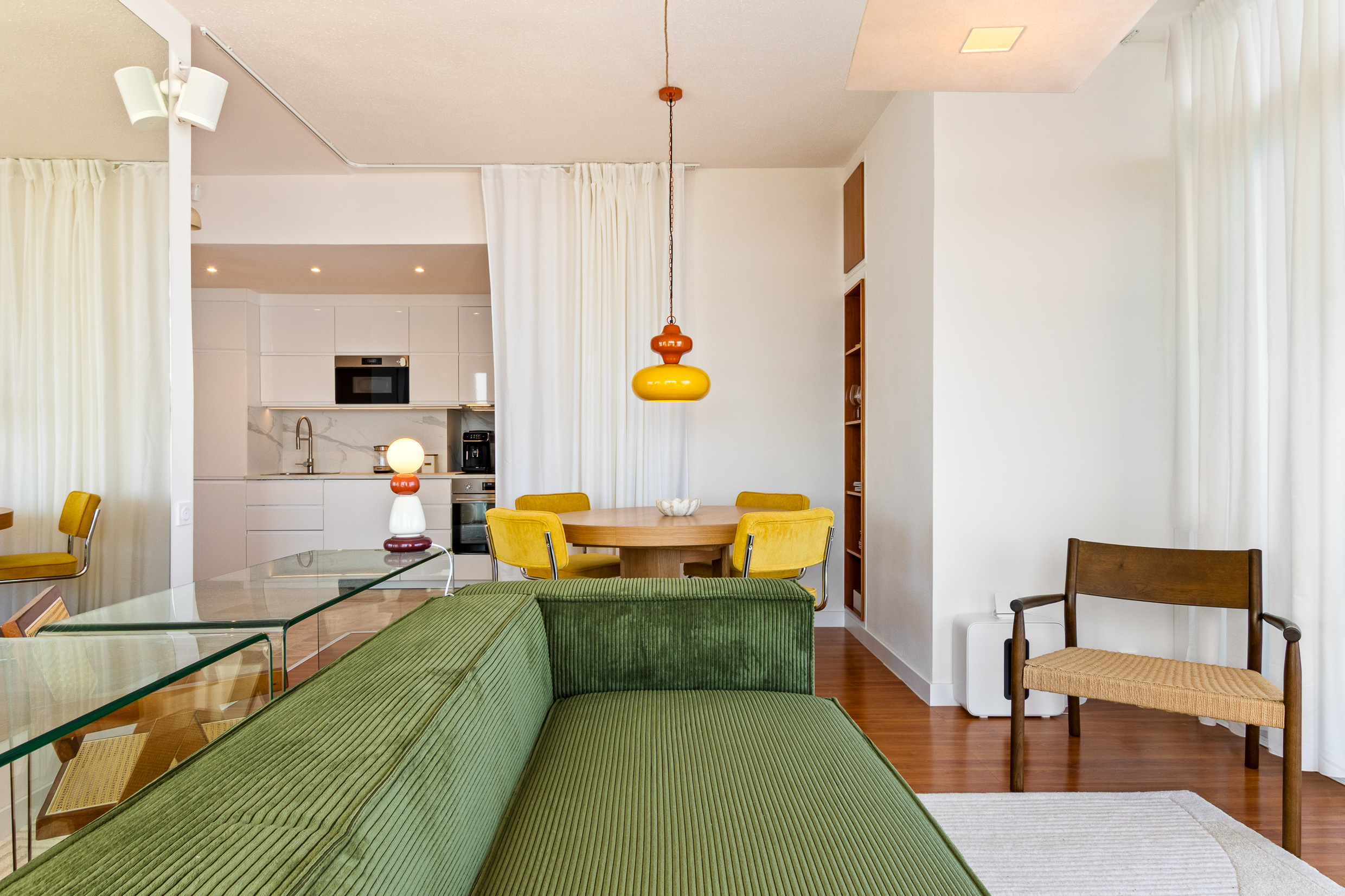 Open-plan living space flowing naturally into the kitchen and dining area.