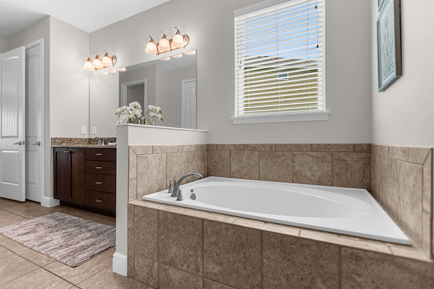 Chic bathroom highlighting a stylish bathtub and an inviting shower area, designed for comfort and rejuvenation in a serene atmosphere.