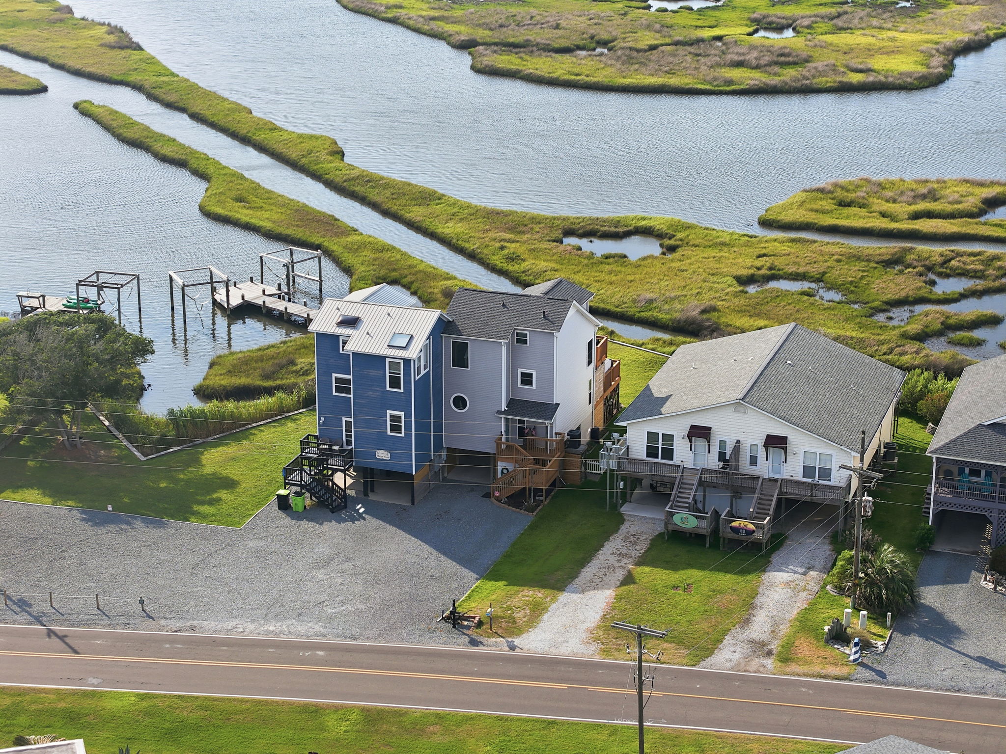 Aerial views showcase this beautiful retreat and its stunning soundside setting. 