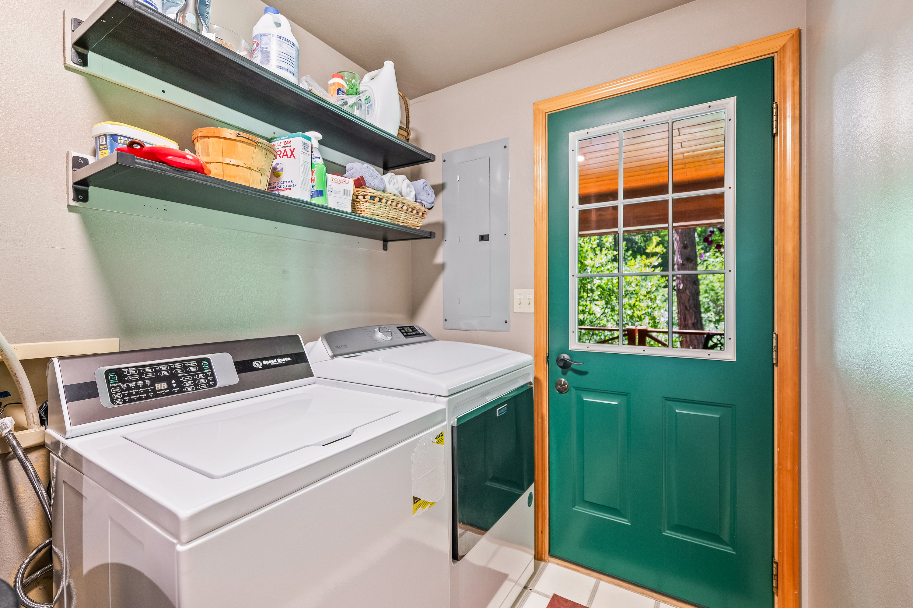 Laundry room opens right to the back porch and hot tub