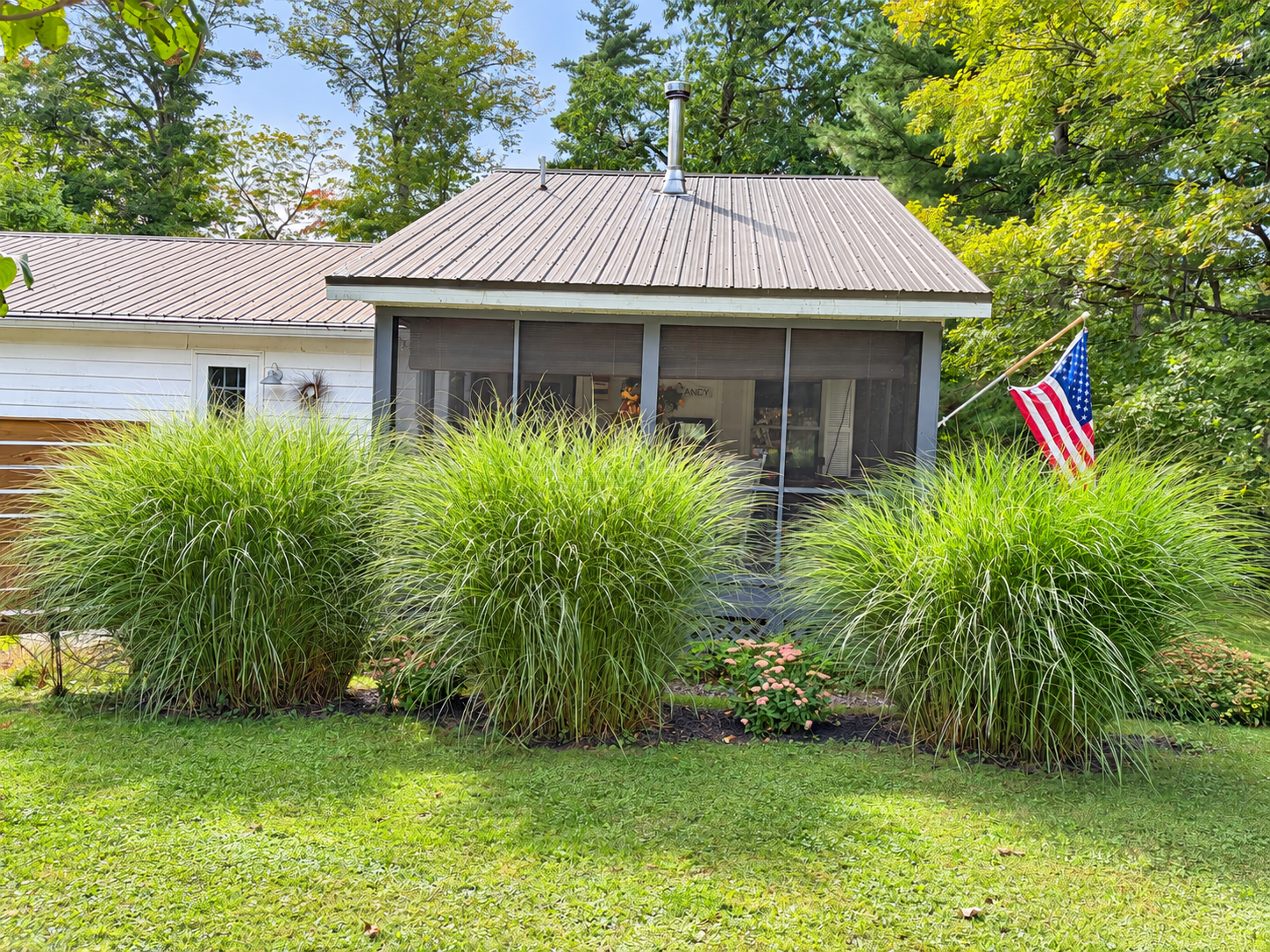 View of the screened in porch from the backyard