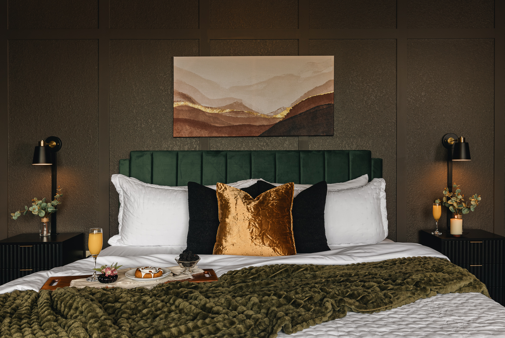 {Bedroom 1} Plush bedding, rich textures, and a statement upholstered headboard make this king suite an inviting place to recharge.