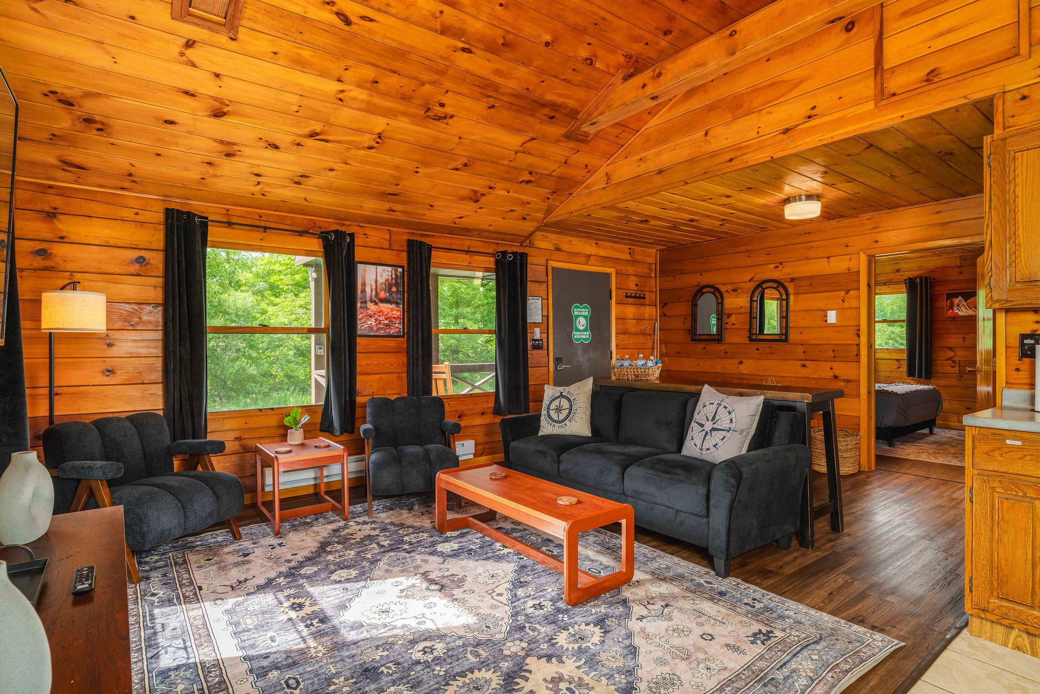 🪑 Living room with cozy seating, easy flow to the dining area, and big windows looking out.
