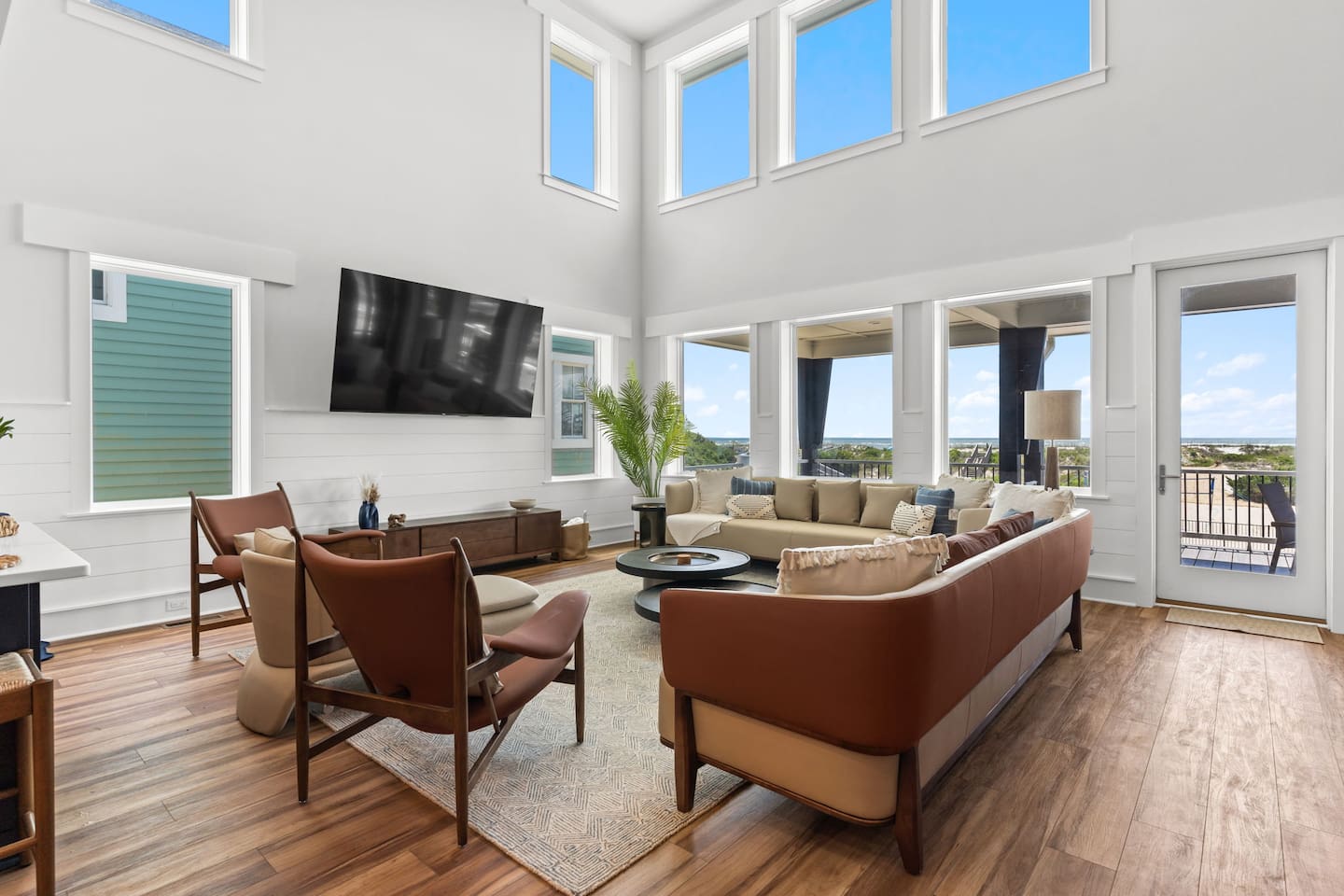 Gather together in the heart of Zen. This stunning two-story living room features oversized sofas, comfortable lounge chairs, and breathtaking ocean views - creating the perfect space to relax, reconnect, and make memories with your group.