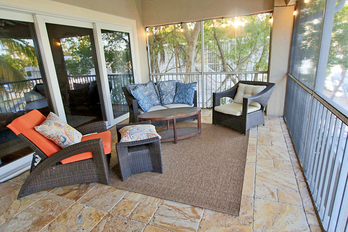 Screened in porch sitting area