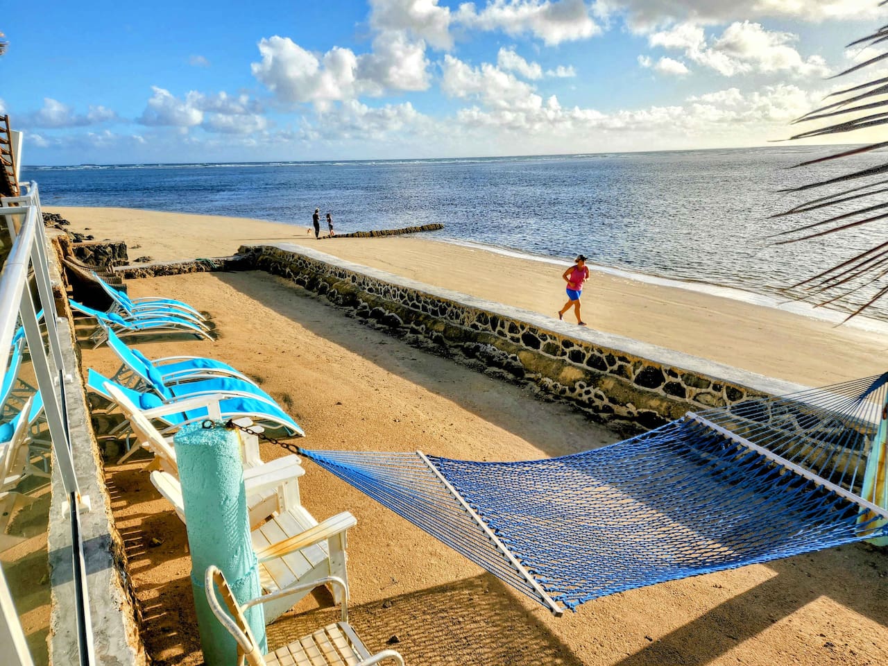 This picture was taken with a CELL PHONE! A centerpiece, true one-of-one feature of the home is the fact that it has its very own enclosed private beach with private steps leading to a crystal-clear,waist-deep turquoise-colored snorkeling coral reef