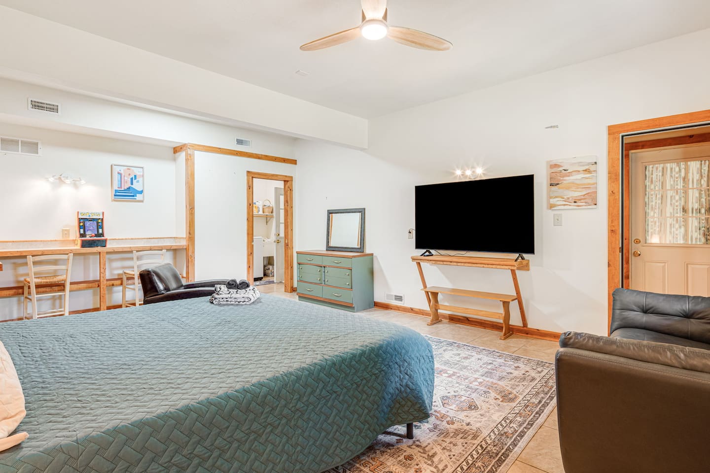 The lower level bedroom has it's own entrance, access to the laundry area, and small kitchenette.