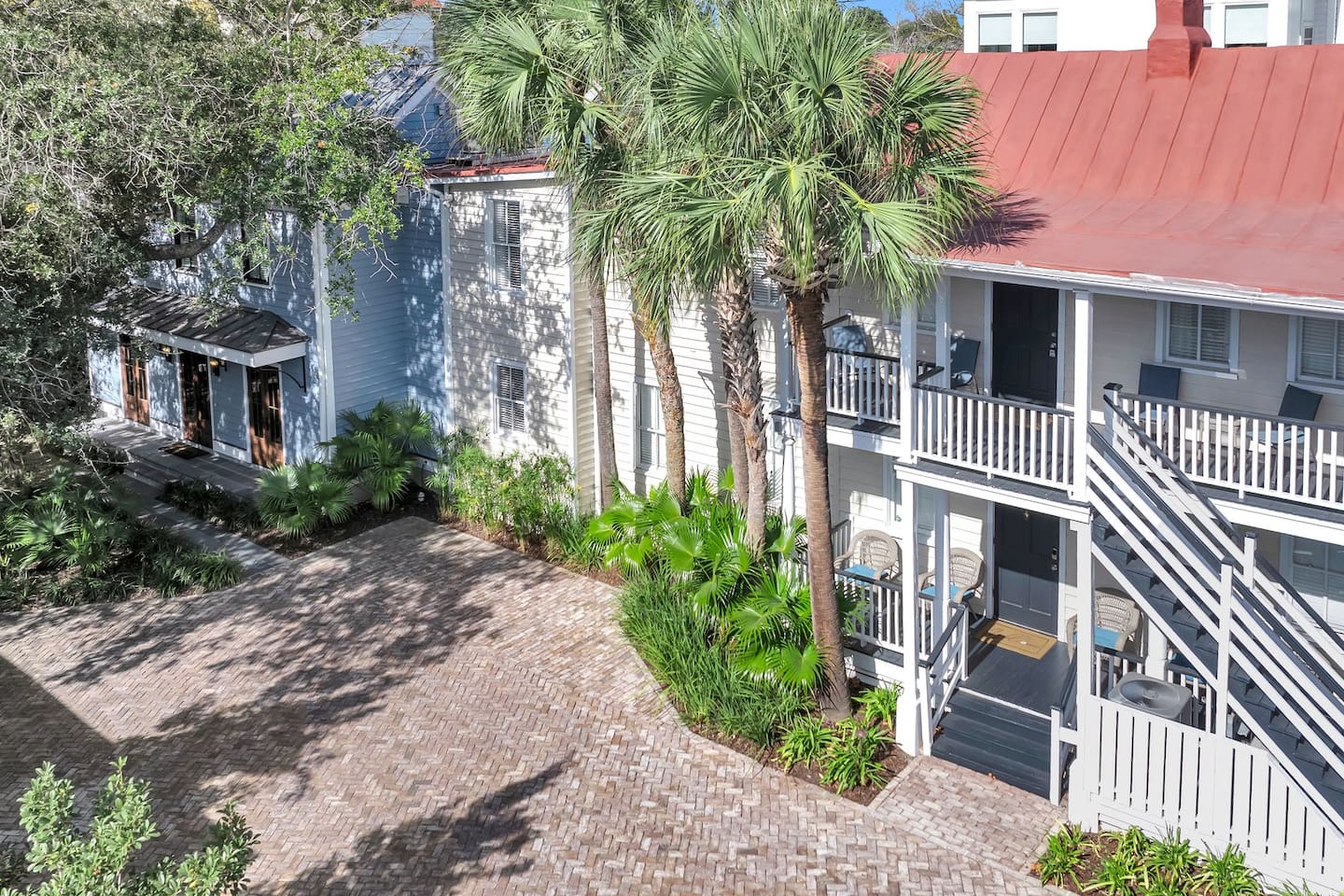 We combined historical charm with a new build. The beige house built in the 1870's had the blue part added in 2022. The full kitchen, (1st  floor, mid-section of the beige house) opens into the dining room and 2nd living room (blue side). 