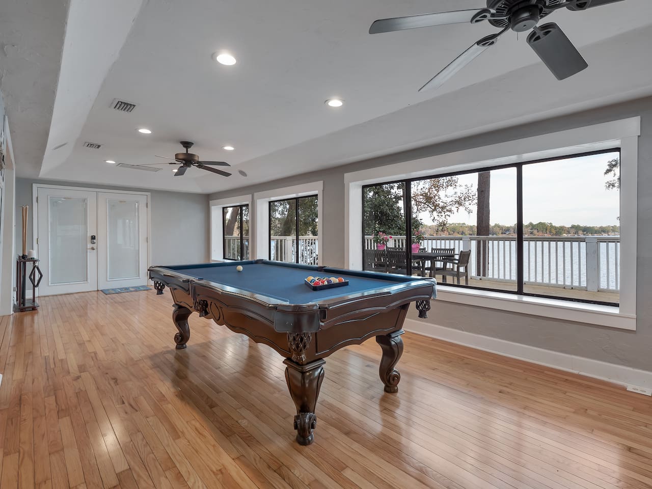 Pool table, lake view, stool seating, tv, deck and dock access
