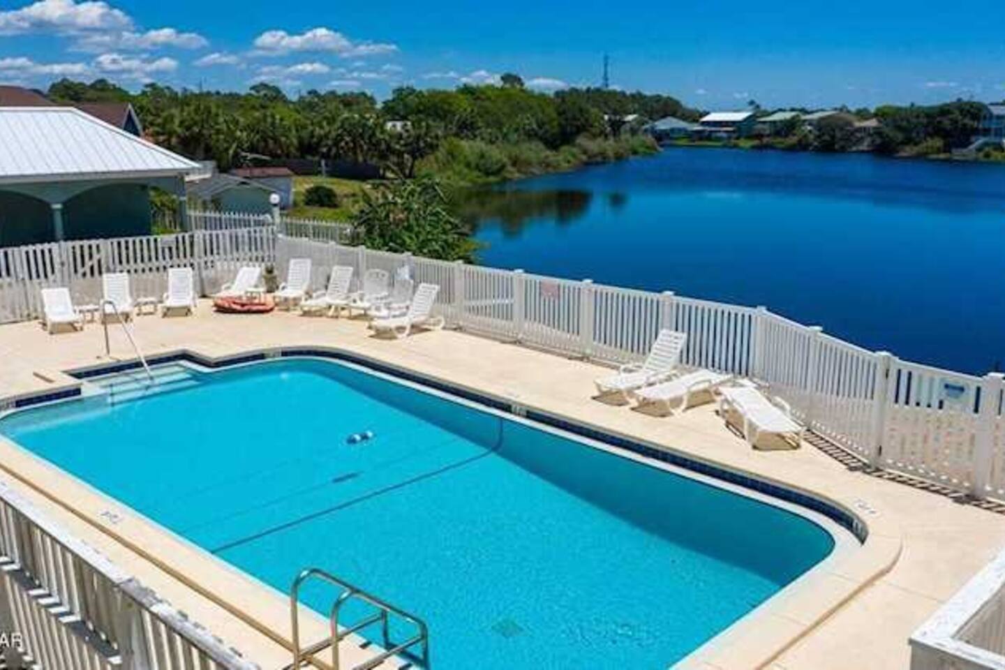 View of pool and lake.