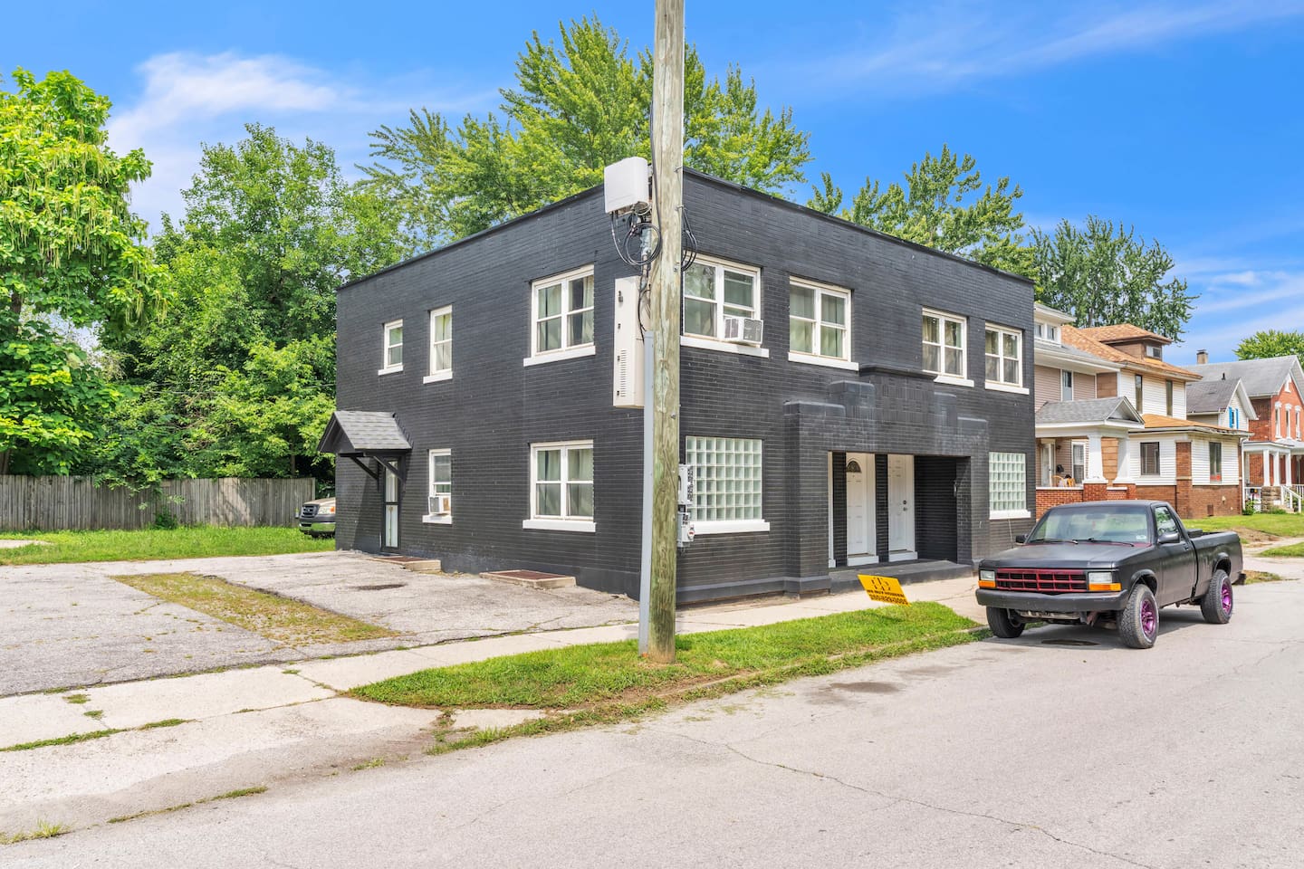 Spacious multi-unit building with private entrances and convenient off-street parking in a quiet neighborhood setting.