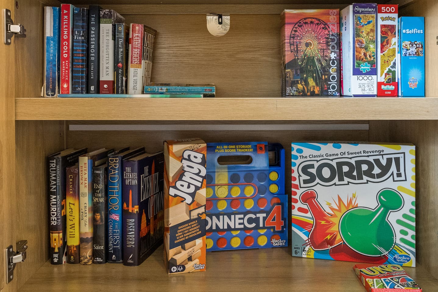 Board games, puzzles, and books available to enjoy as a family.