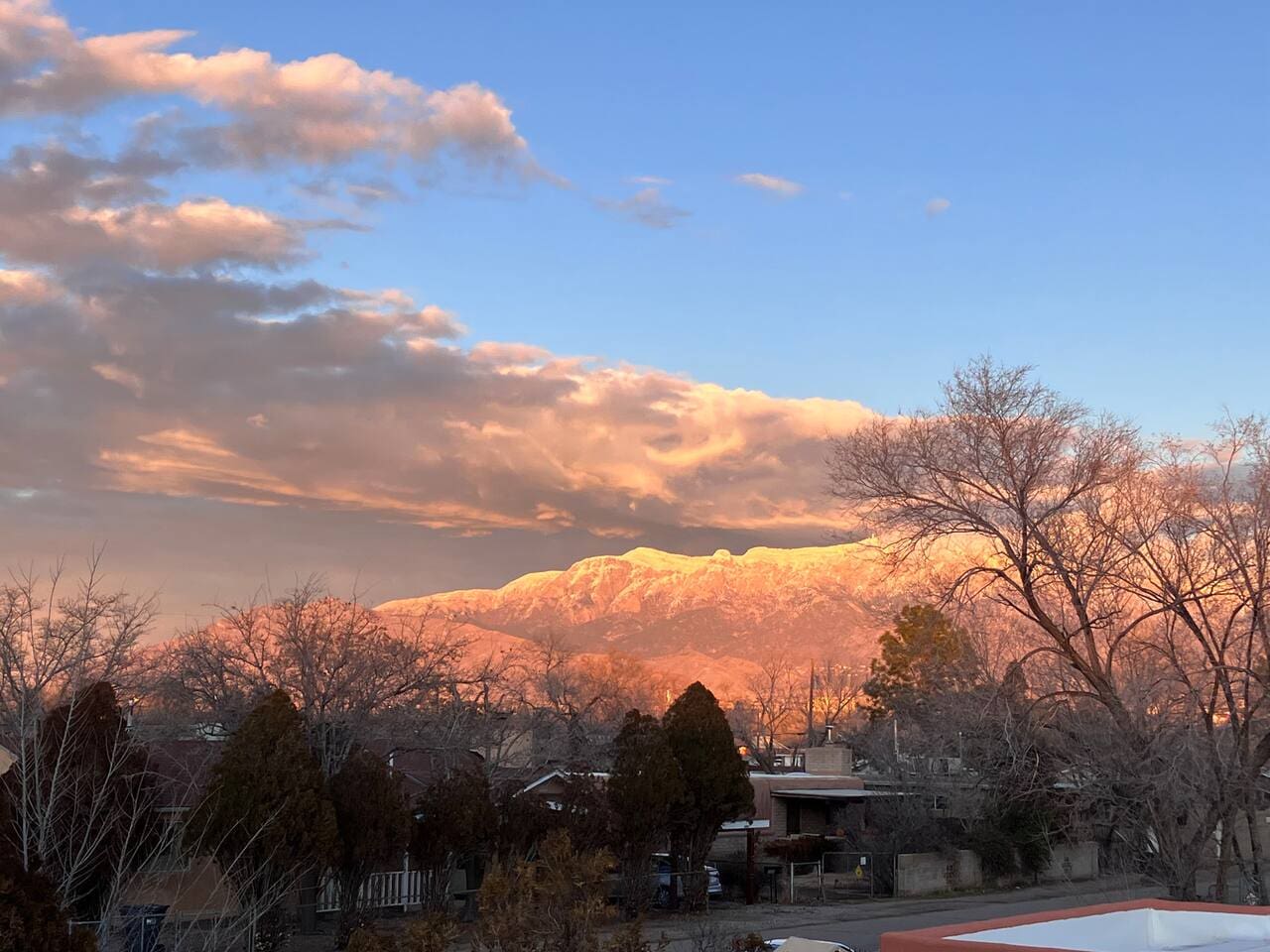 The 10,300 ft Sandia Mountains from our winter window. In Spanish, Sandia means “watermelon”. Can you see why? 