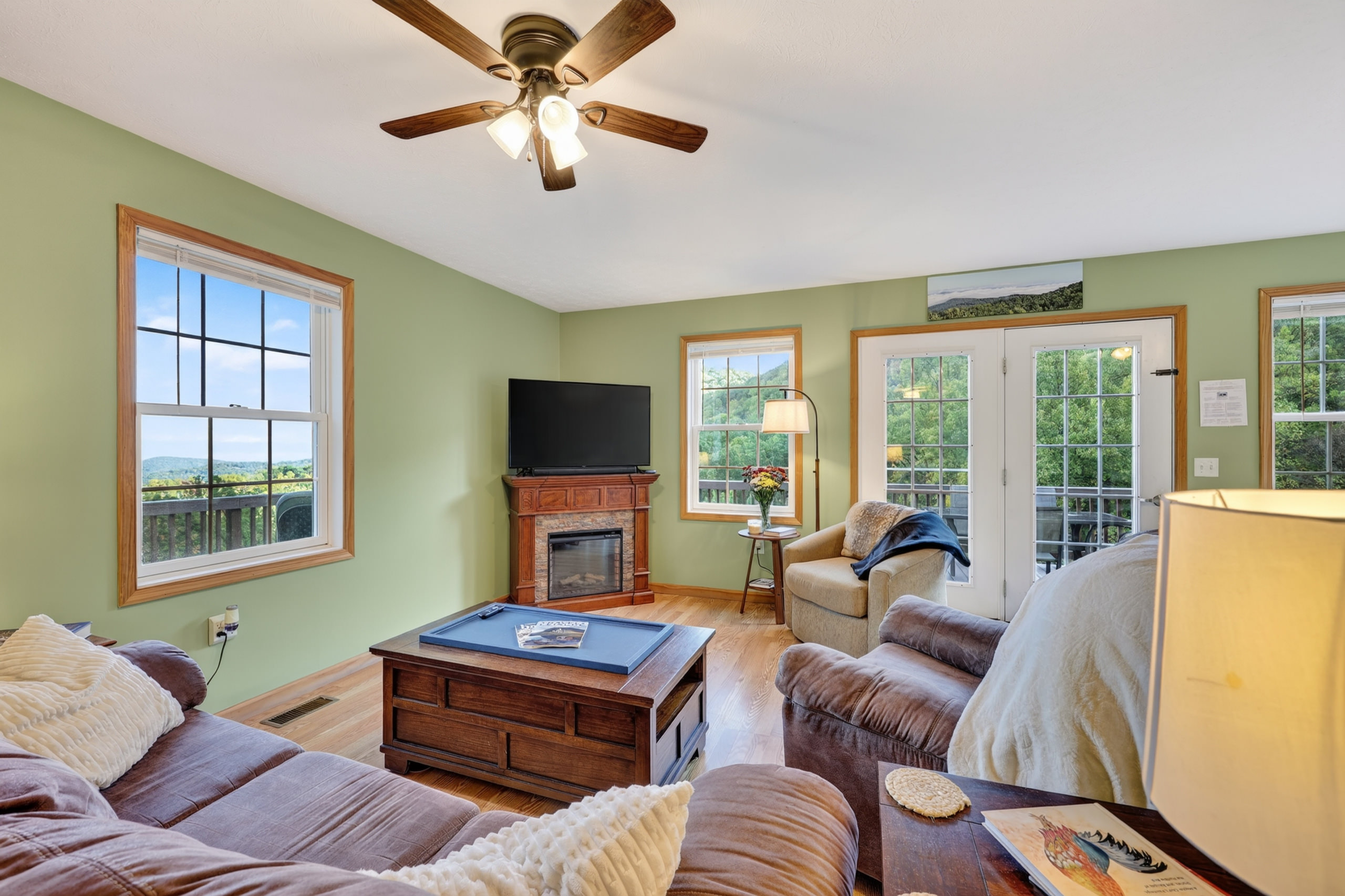 Our living room includes a TV with Roku and sound bar that doubles as a bluetooth speaker. The sofa folds out into a bed. The coffee table raises up to desk height if you need to work.