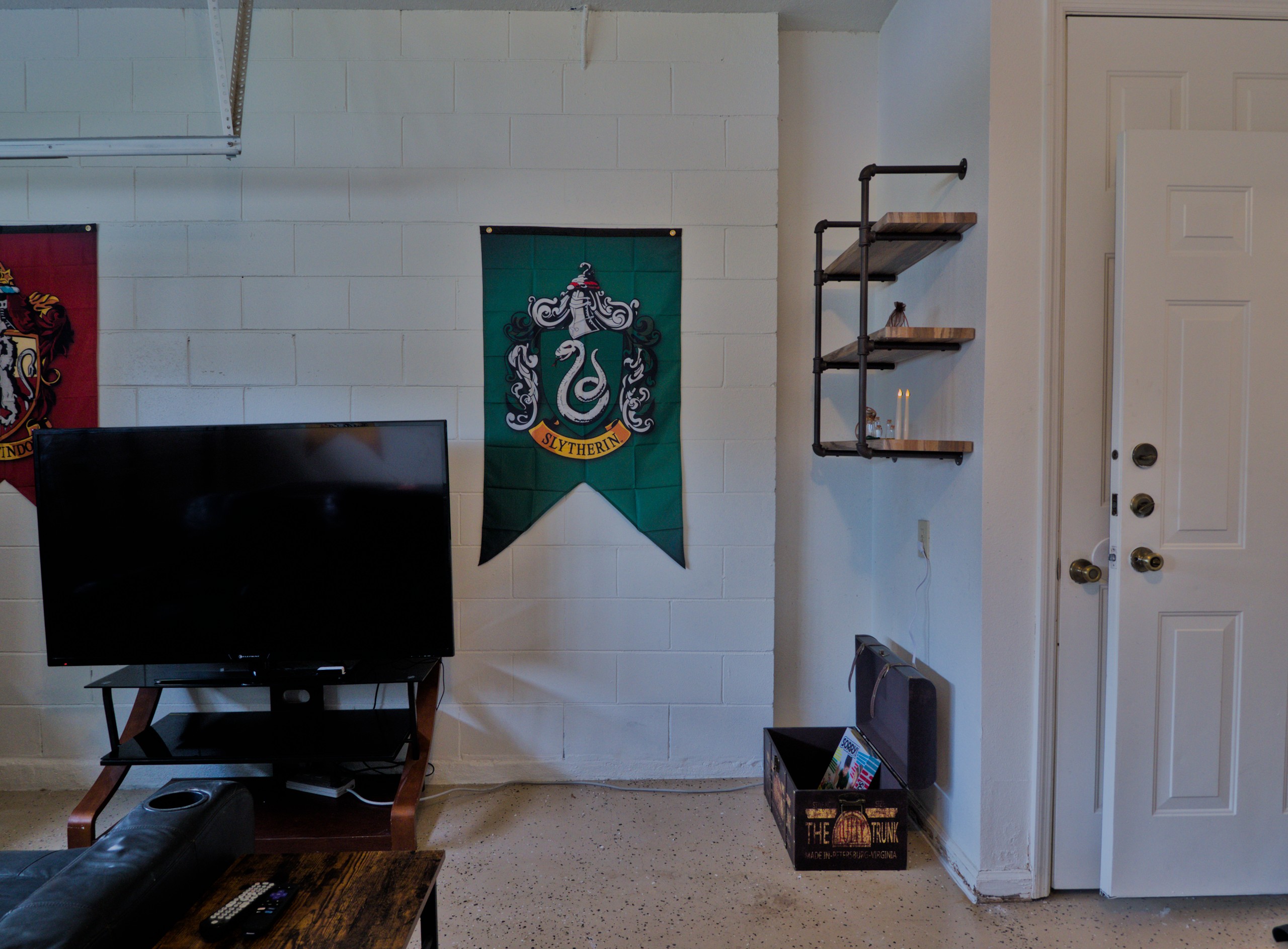 Harry Potter themed game room with TV, pool table/table tennis.