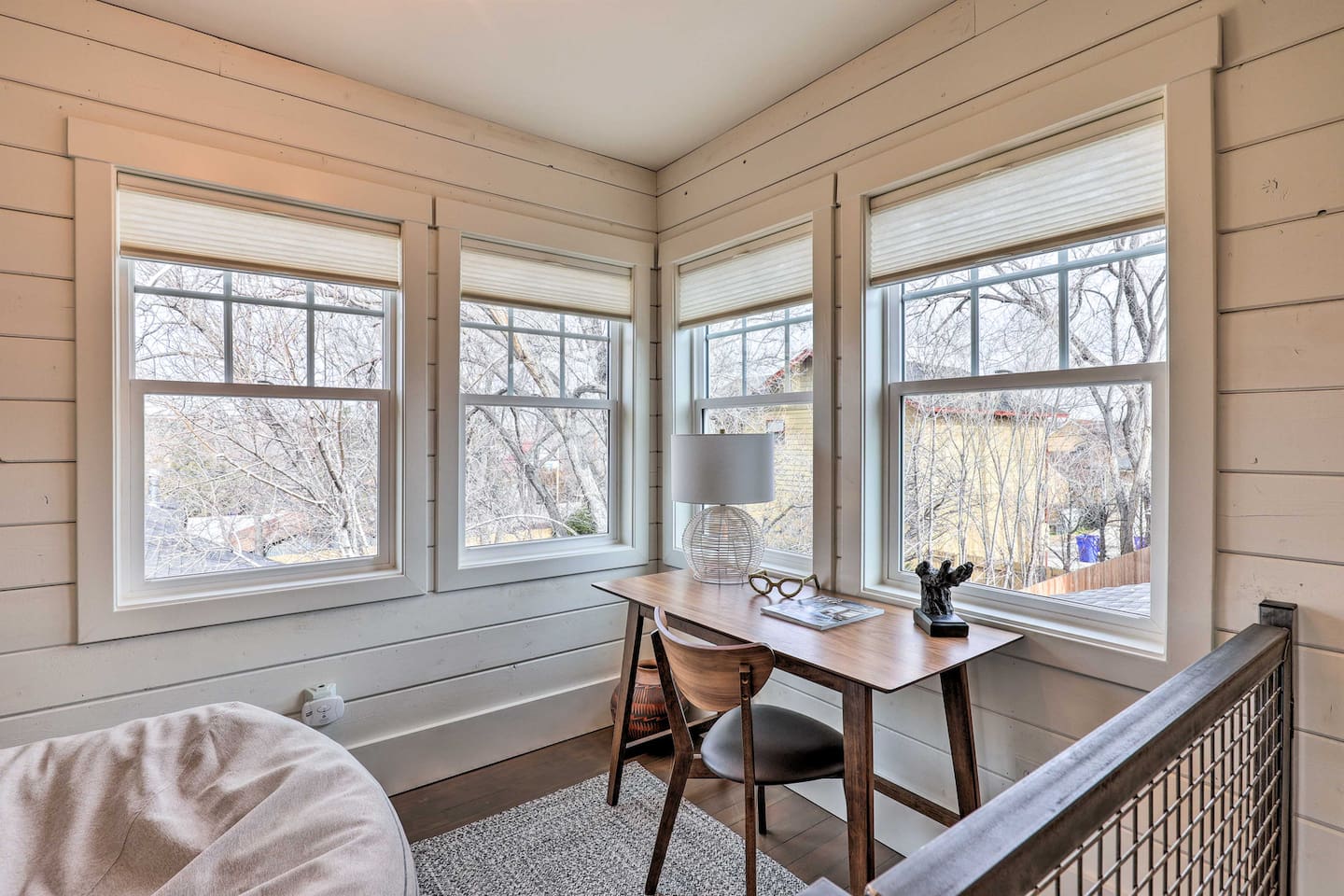 Wraparound windows flood this workspace with natural light, making it easy to stay productive on the road.