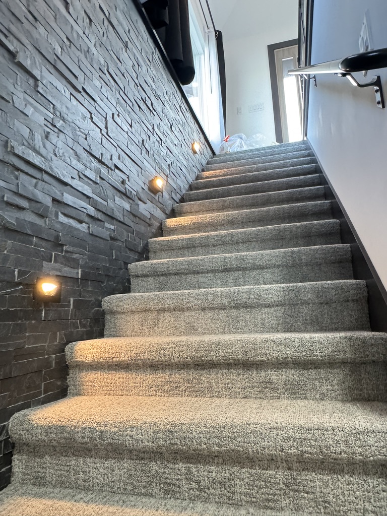 Lighted stairway to the lower level