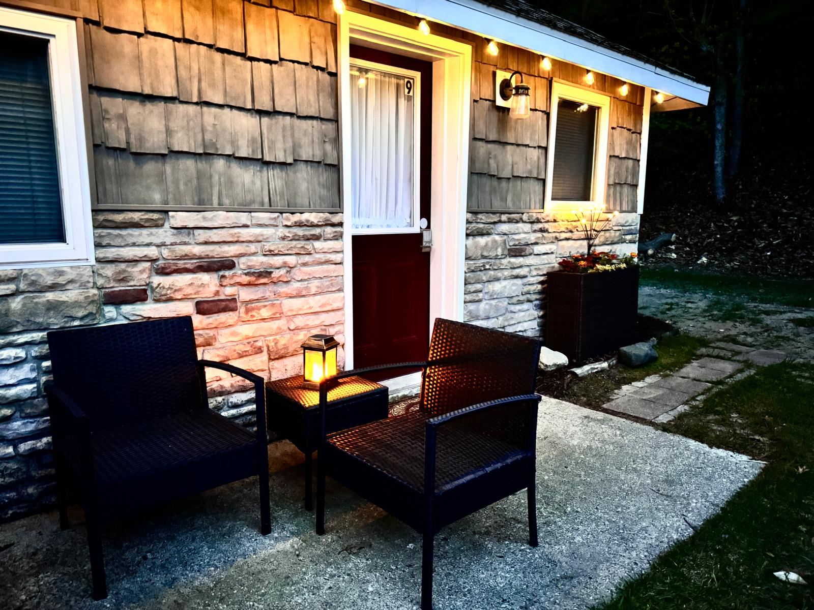 Dedicated door takes you to the back patio with a bistro set, umbrella, solo stove, charcoal grill and romantic string lights to enhance your stay.