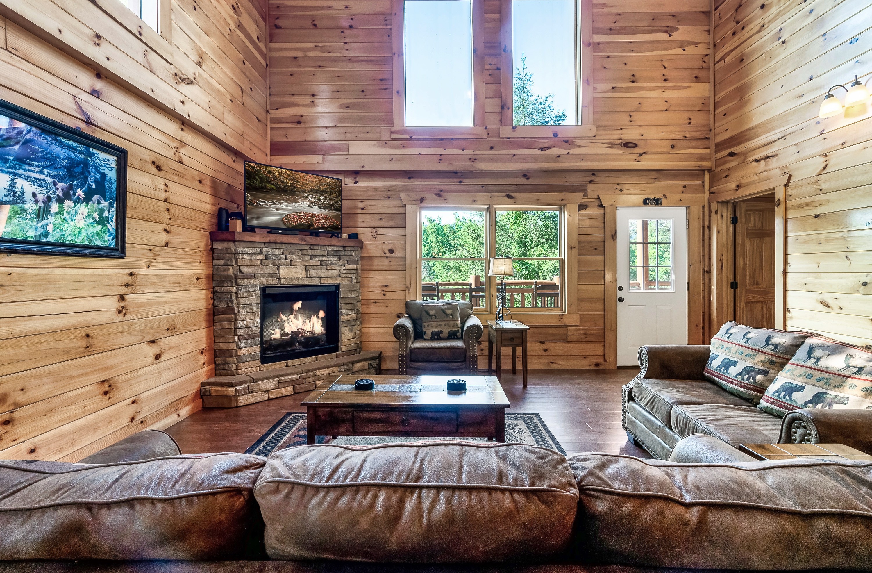 Relax together in the light filled living room where vaulted ceilings, warm wood, and mountain charm set the tone.