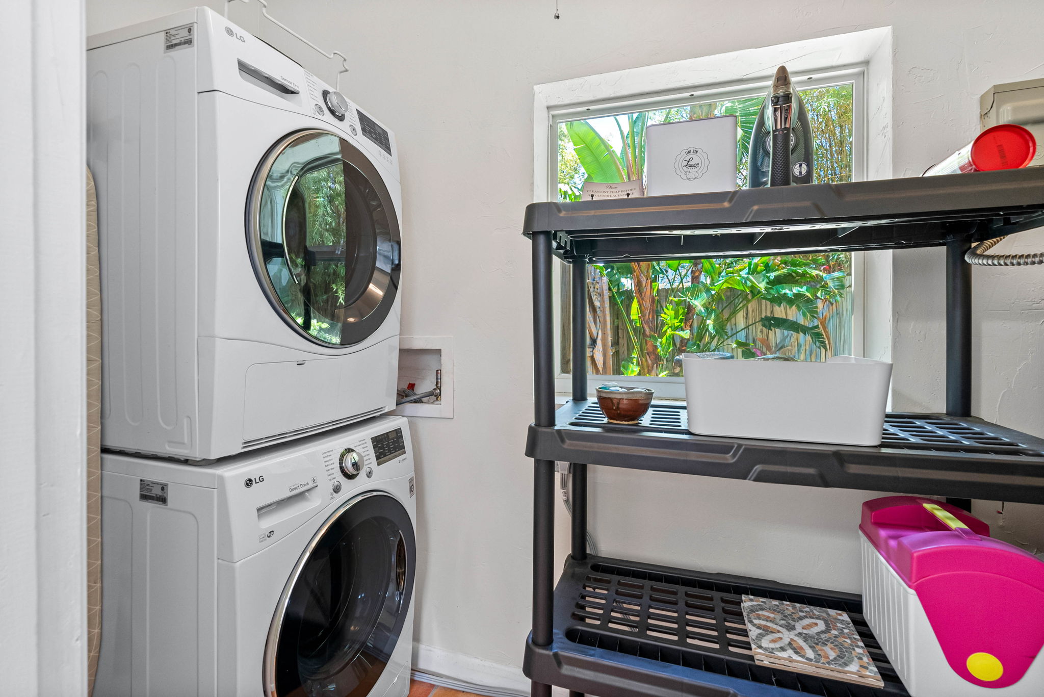 Laundry Area - Equipped with a washer, dryer, ironing board and iron