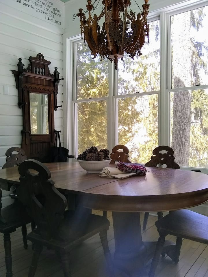 The dining porch is a lovely gathering place for the whole group.