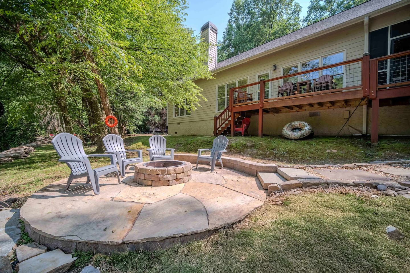 Gather around the rock fire pit in the backyard—perfect for roasting s’mores and making memories.
