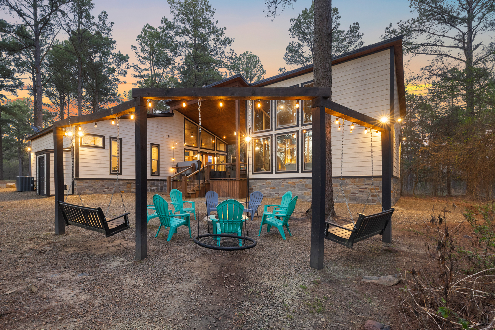 String lights, outdoor TV, fireplace, dining, grilling, hot tub, and a full conversation set all under one covered deck. This guest favorite spot brings everyone together to relax, connect, and even watch TV right from the hot tub.