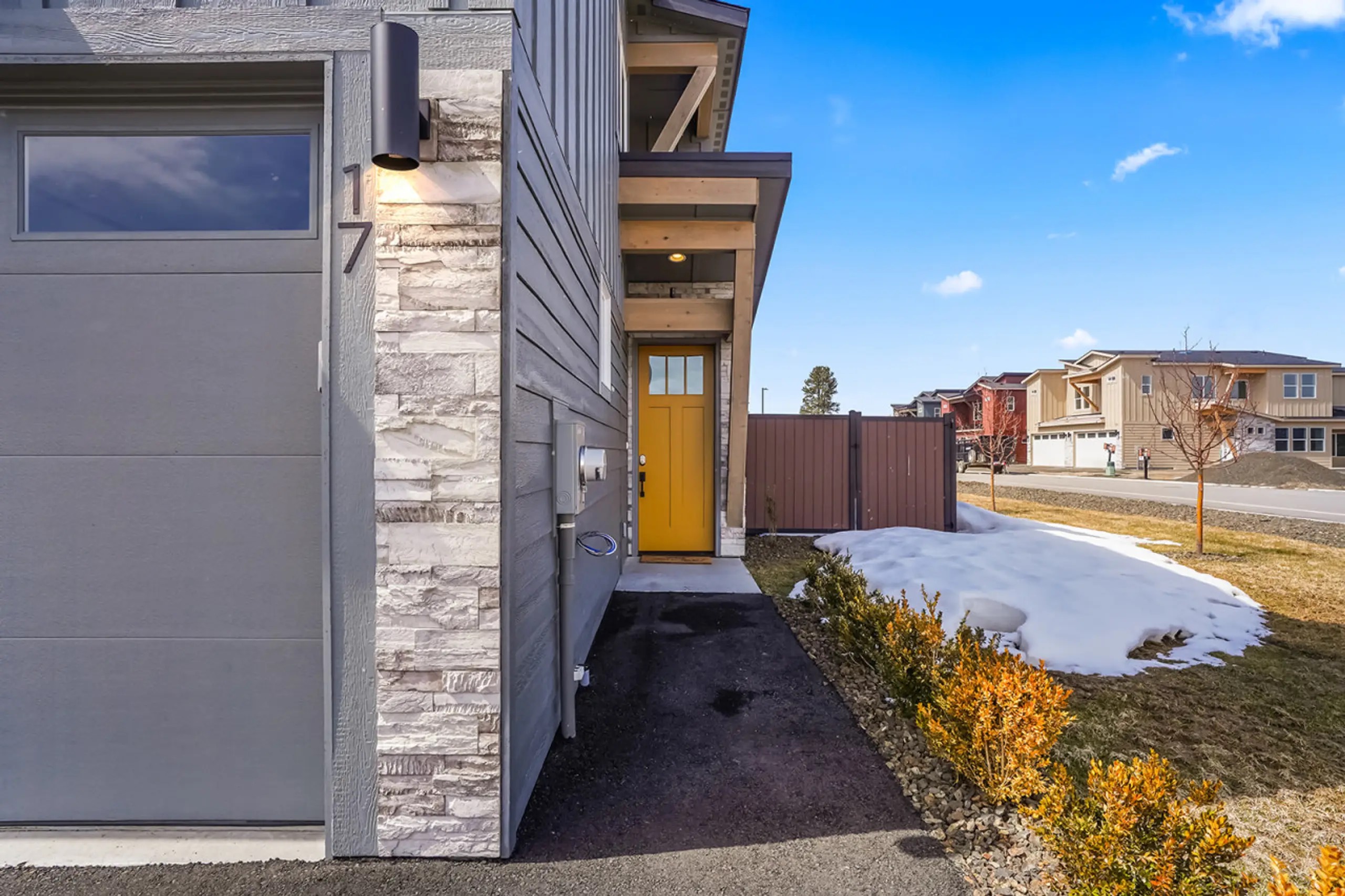 Modern exterior with a bright, easy to find front door.