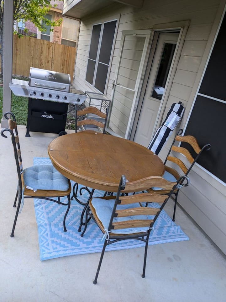 Private patio dining for 4 with outdoor furniture, BBQ grill, and a charming atmosphere for morning coffee or evening dinner outdoors.