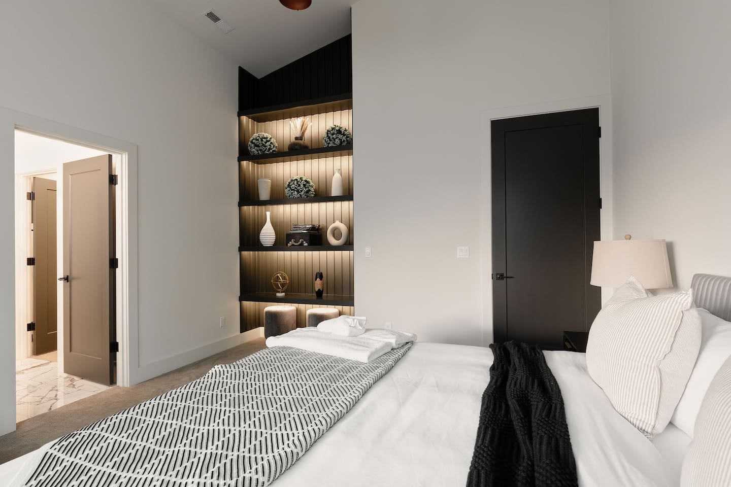 This is our master bedroom on the main floor, featuring a standing shower and a spacious closet.