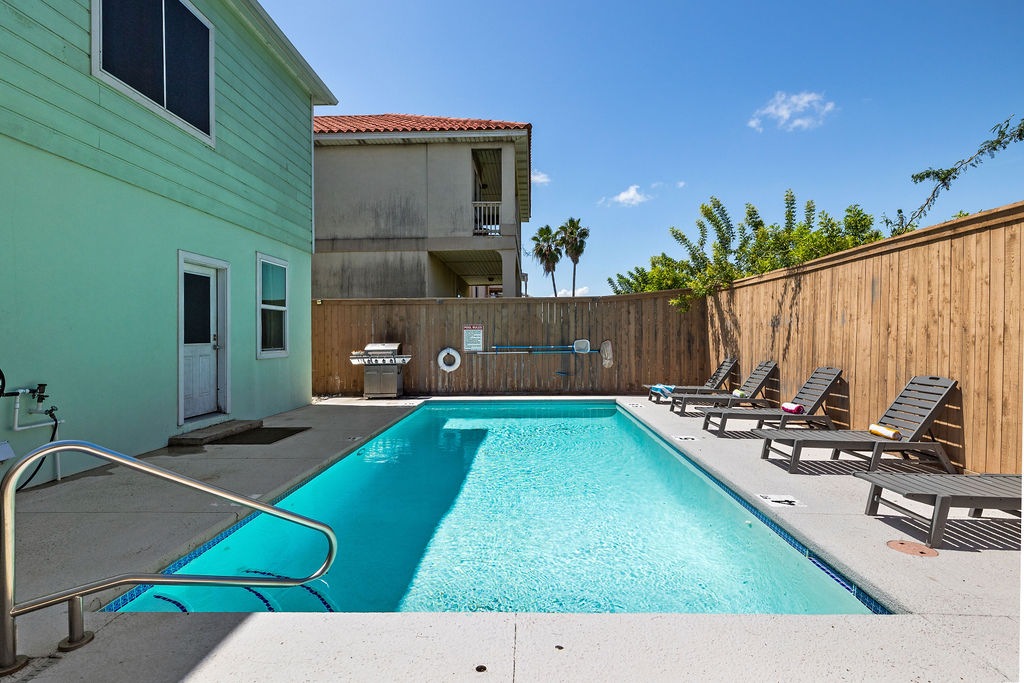 Experience resort-style relaxation at your doorstep. Elegant loungers line the shimmering pool, creating the perfect setting for tanning, reading, or simply recharging beneath the warm Destin sun