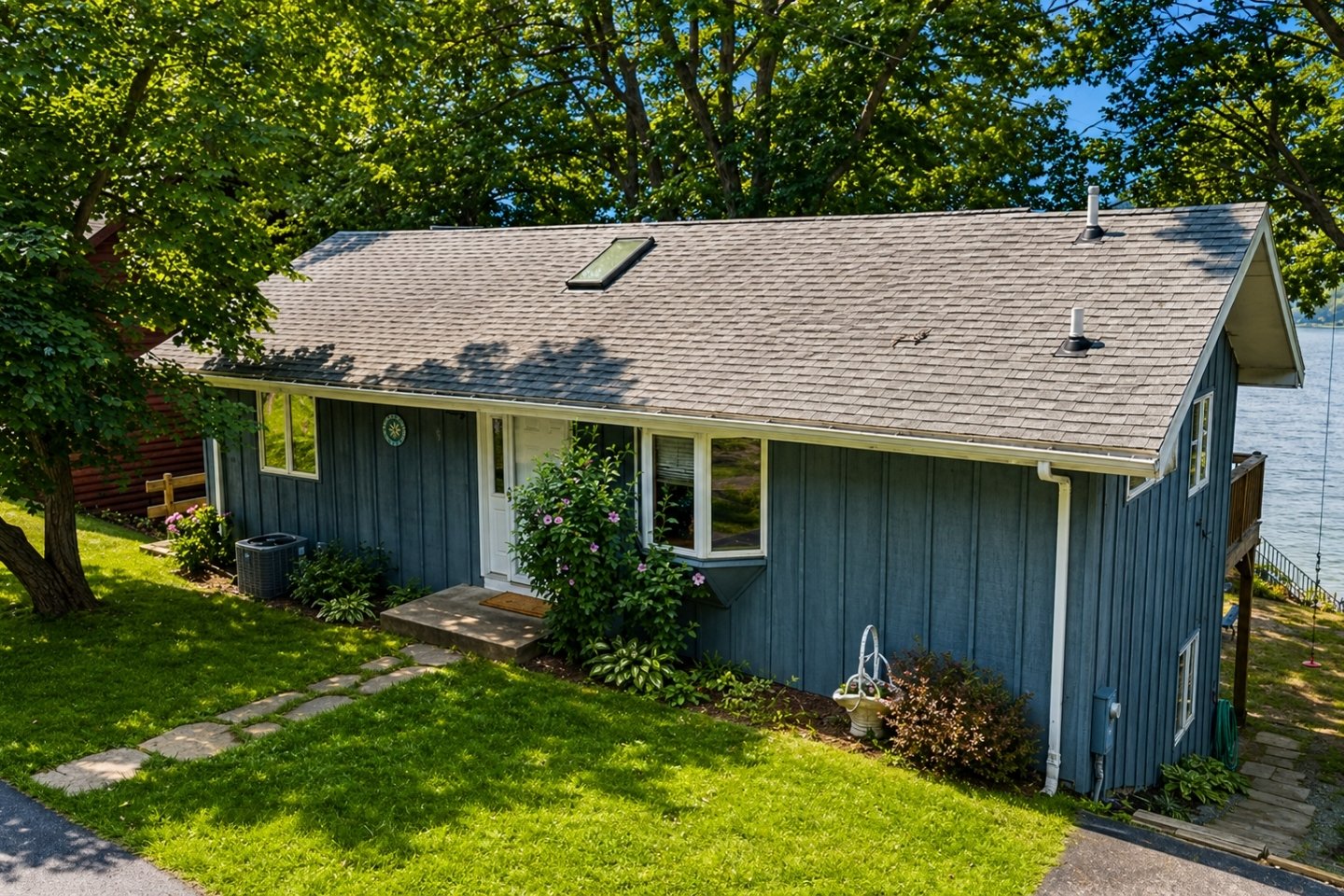 This quaint cottage nestled among the trees offers a perfect escape with modern amenities and picturesque lake views. 