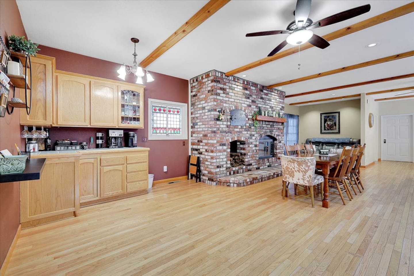 Coffee, tea, and wine station with extra cabinet storage beside the dining area.
