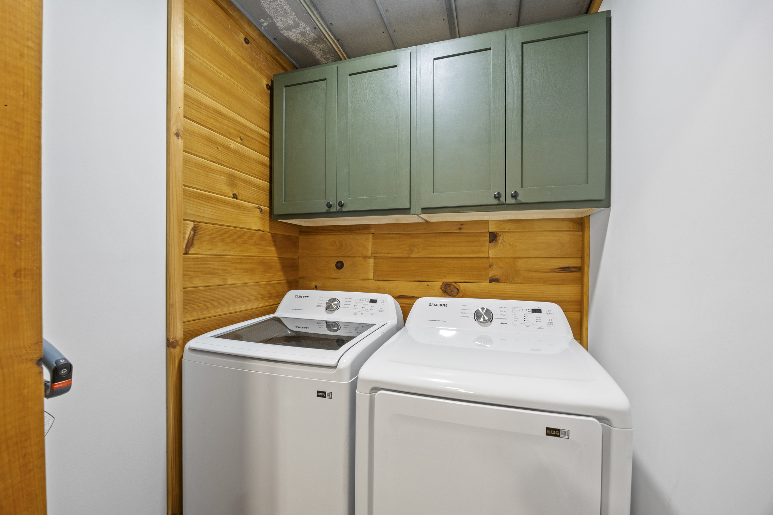Laundry area with washer and dryer available for guest use.