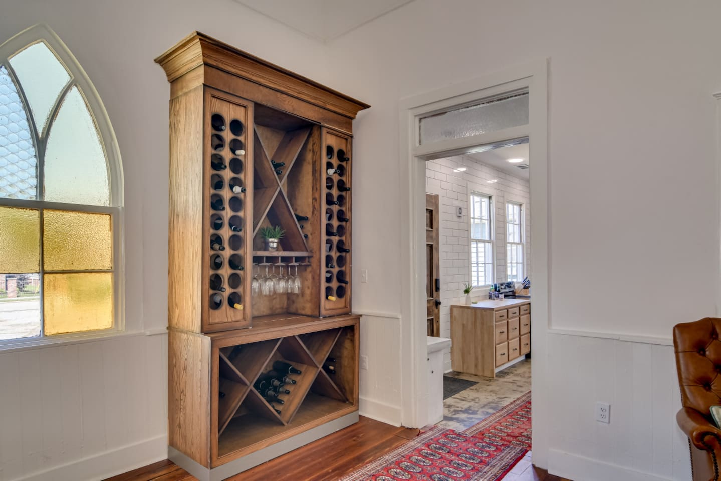 Grand entry hallway with original wood floors and high ceilings.