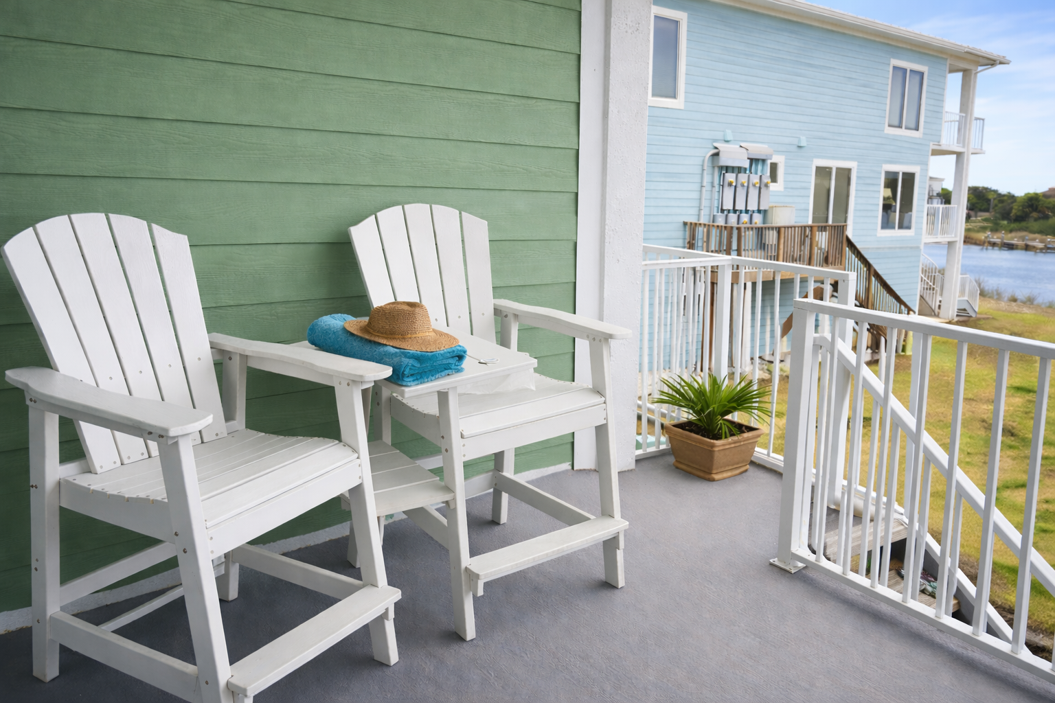 Private waterfront balcony with outdoor seating