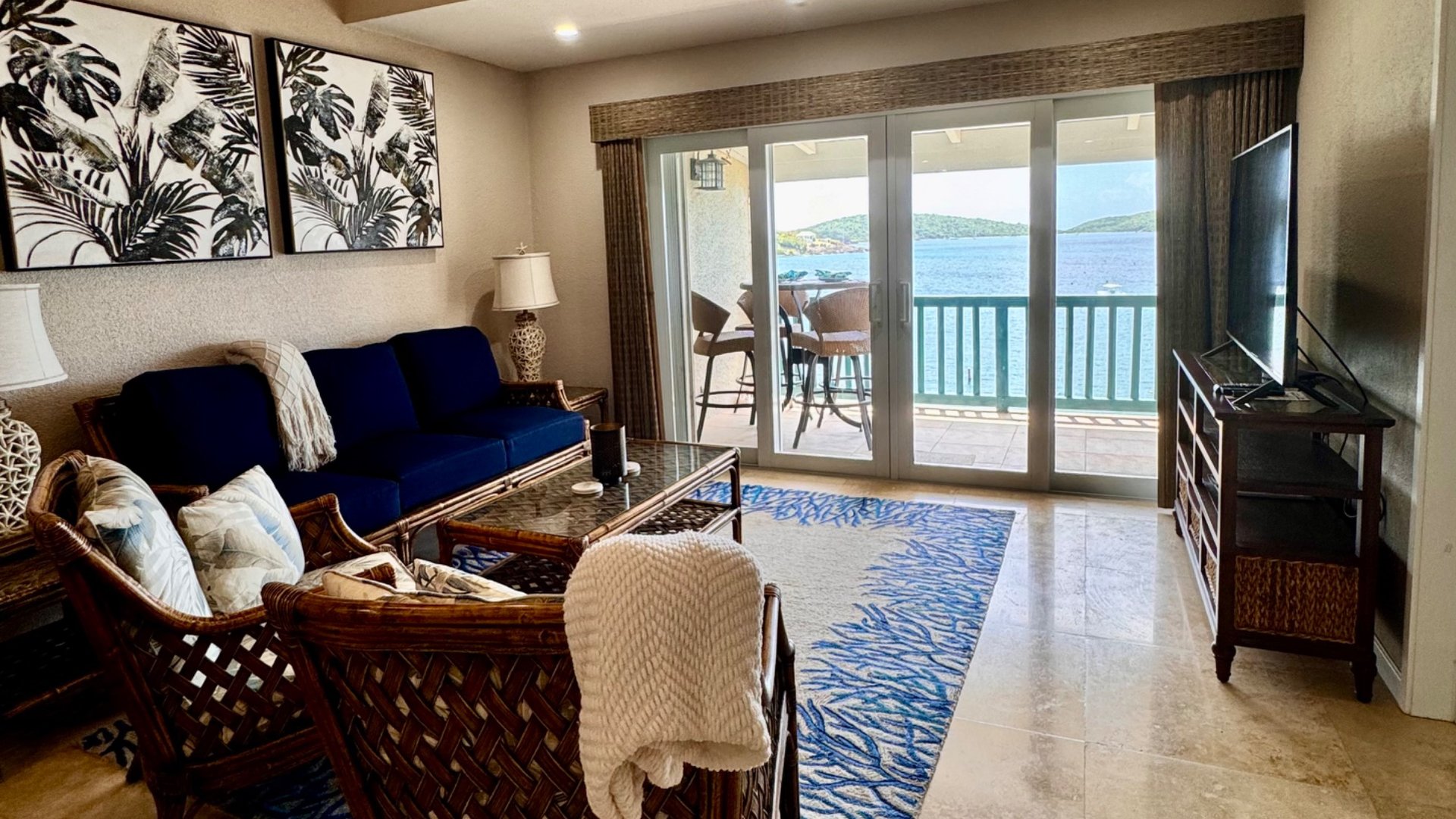 The oceanfront great room living area overlooks the yacht club moorings. 