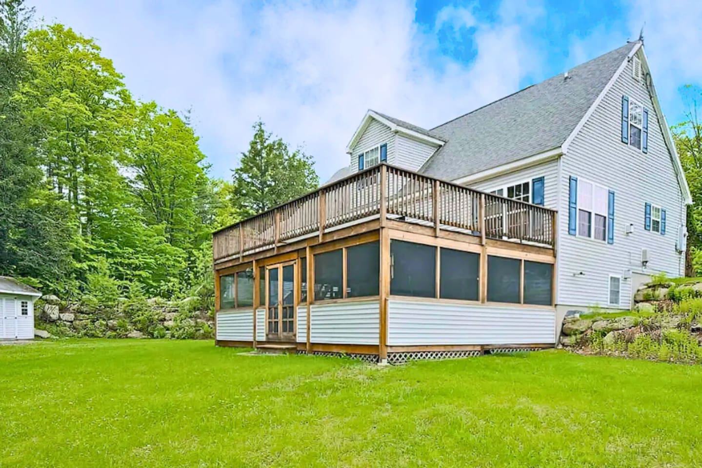 Enclosed porch with a nice hot tub or a big deck for the whole family to hang out on for a cook out this home can fit everyone! 
