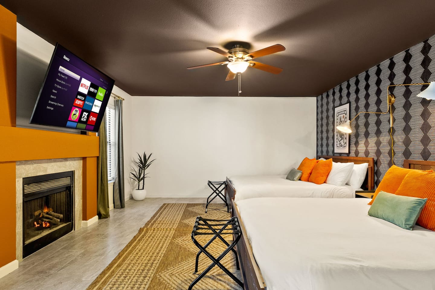 Cozy up by the fireplace and stream your favorite shows on the big screen in this bold, modern bedroom. With 2 comfy king beds on the main floor, stylish décor, and space to spread out, it’s the perfect setup  families, or friends traveling together.