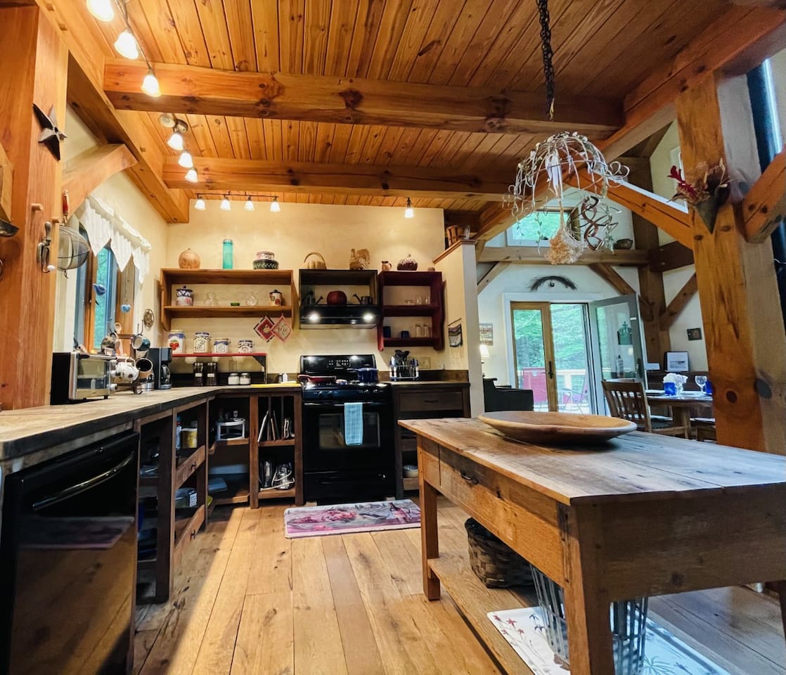 Cheerful custom kitchen with everything you need to cook in. There is a grill on the porch as well