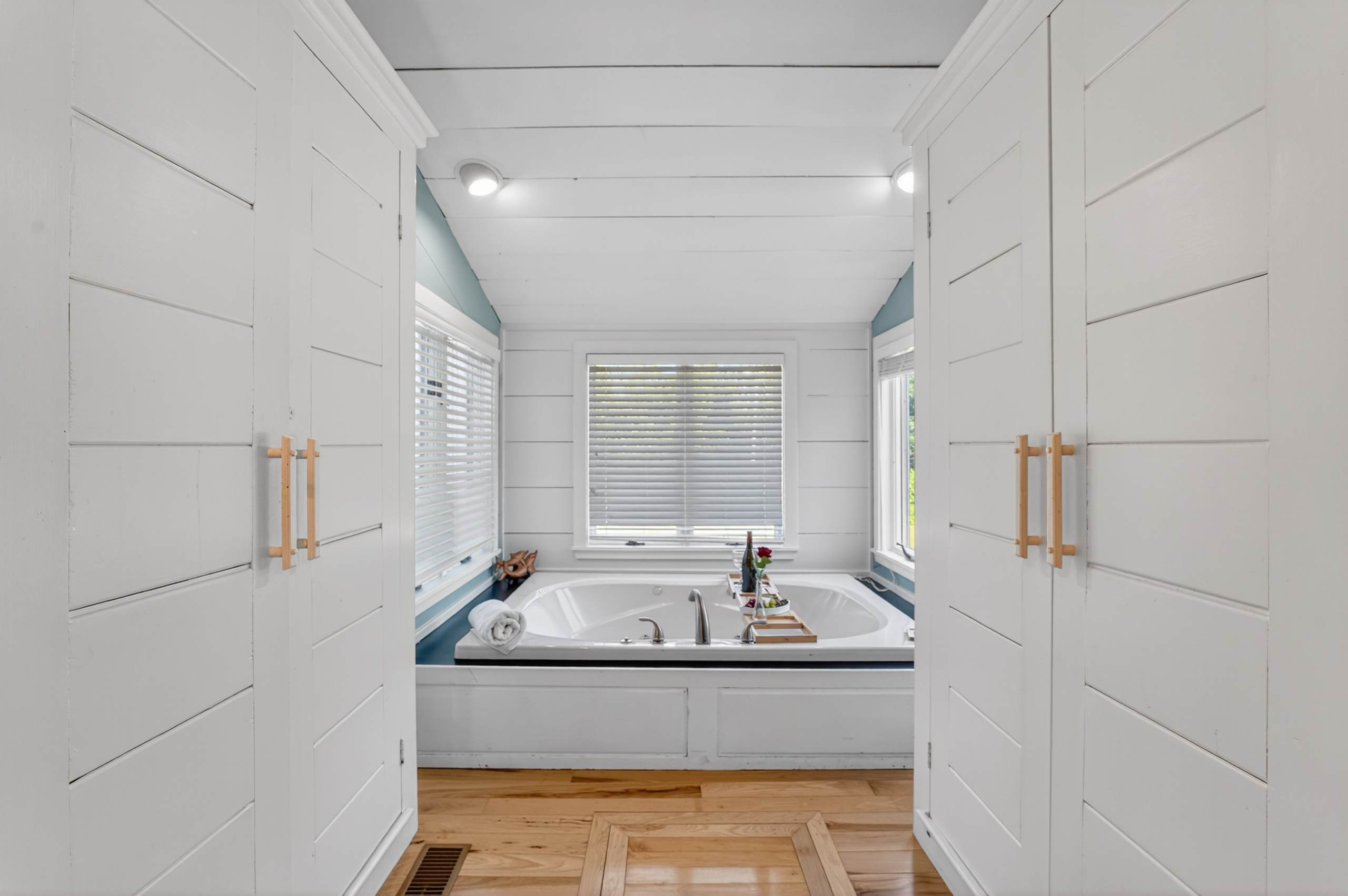 Spa-inspired bathroom featuring a soaking tub, double vanity, and plenty of storage for your stay.