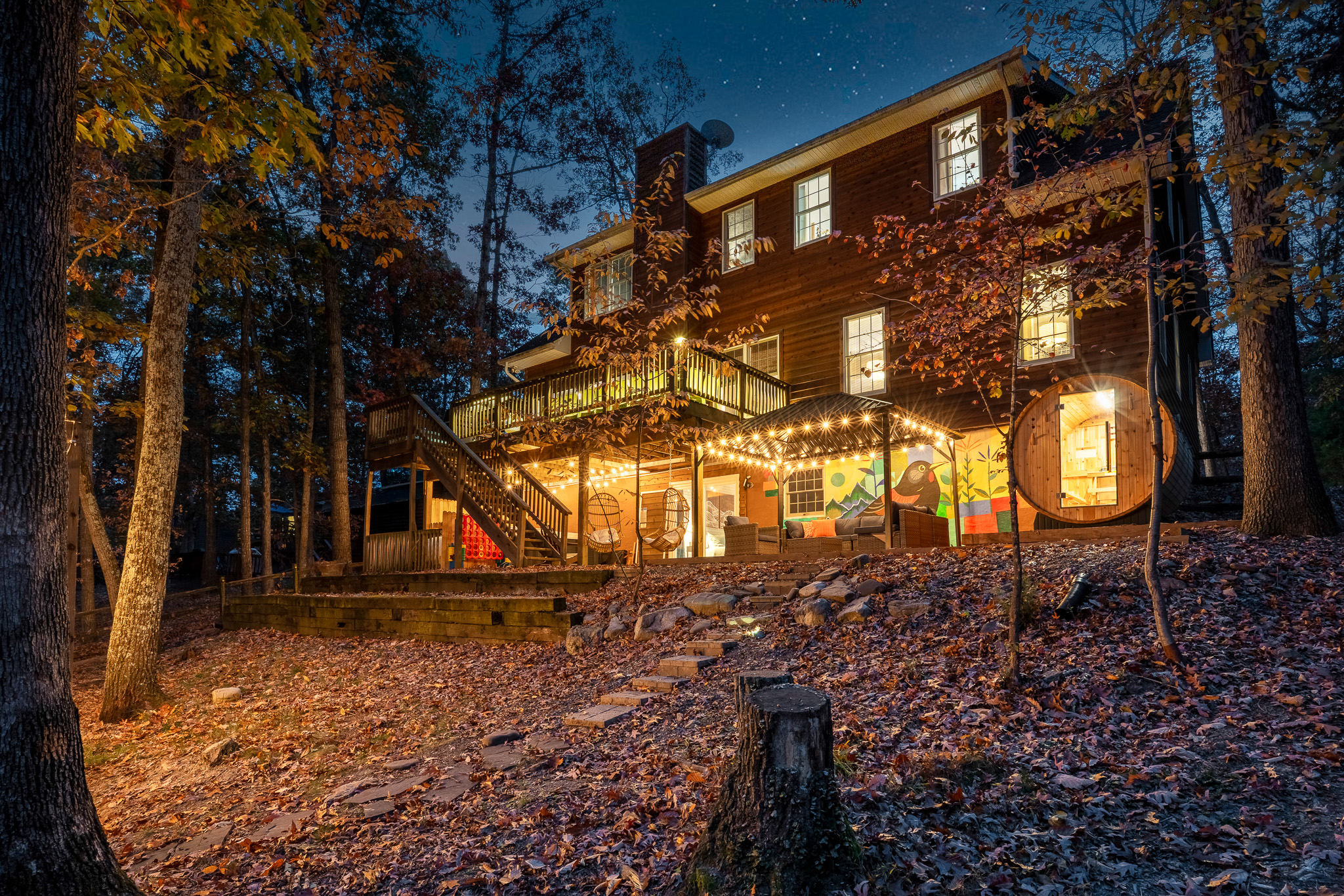 The magic hour at The Pleasant Pause—string lights glowing, sauna warming, and the whole backyard inviting you to slow down.
