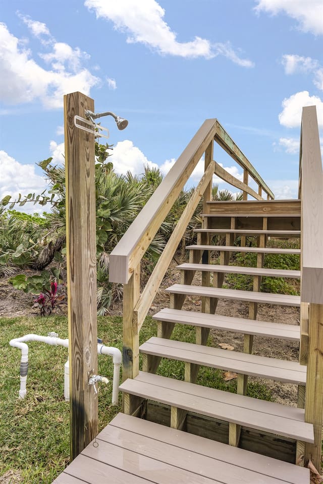 Experience the charm of the house's exterior, featuring a beautifully designed wooden bridge that adds a rustic yet elegant touch, leading you toward the tranquil surroundings and inviting atmosphere of the property.