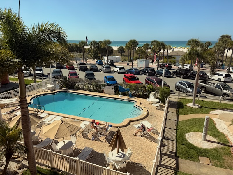 The heated pool is in front of the next building to the South.