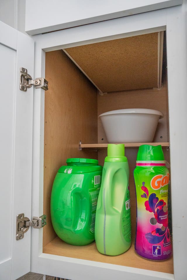 Cleaning materials are conveniently stored in the sink cabinet for easy access during your stay.