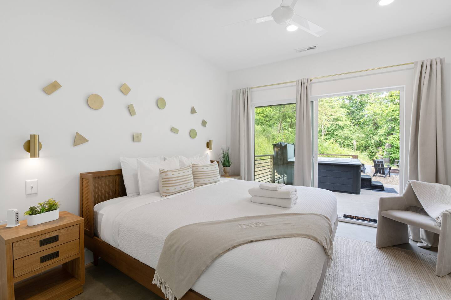 Downstairs Primary bedroom with king bed opening to the private deck with hot tub. 