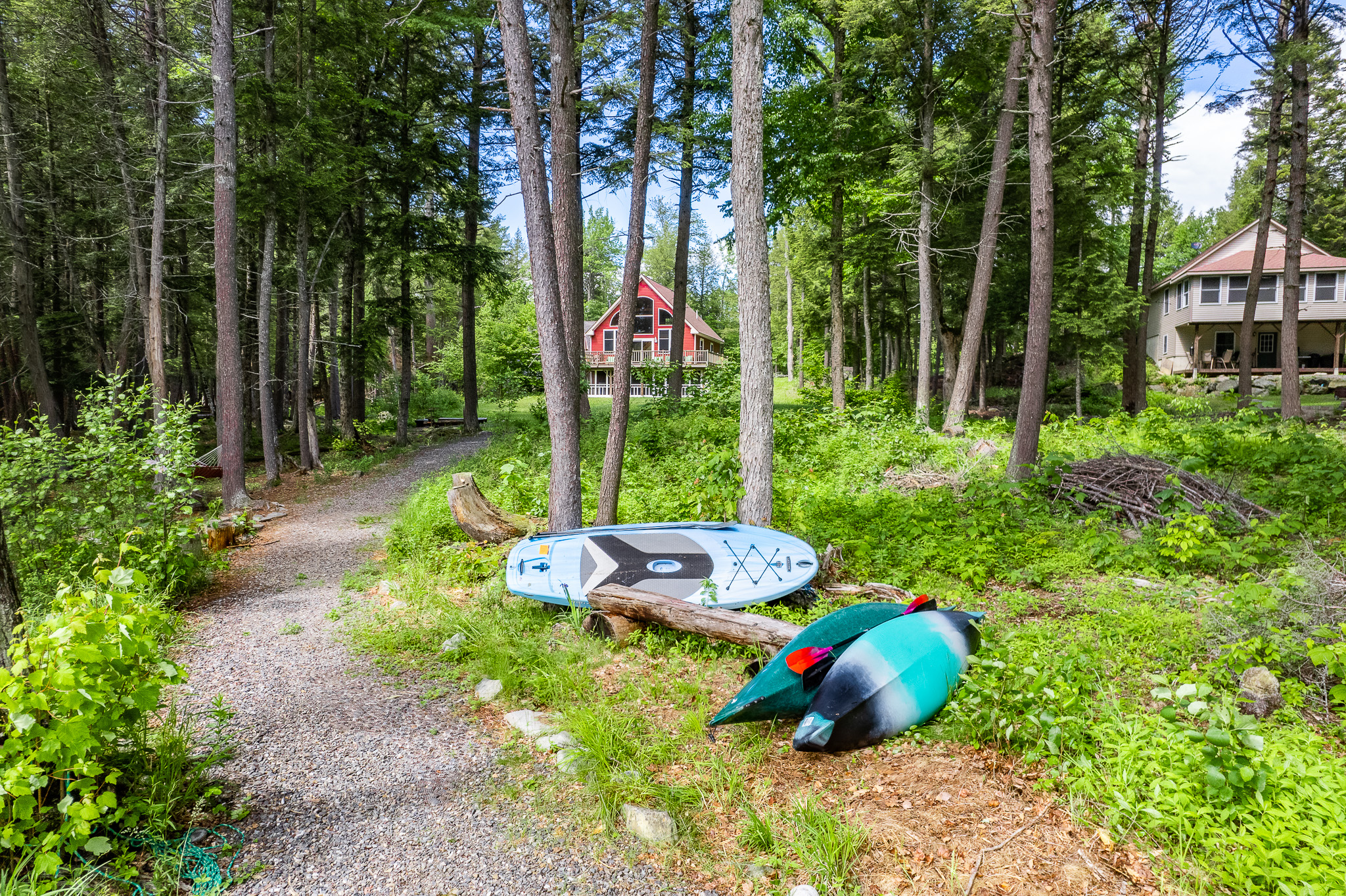 Path to the dock with 2 kayaks and 2 paddle boards (use at own risk).