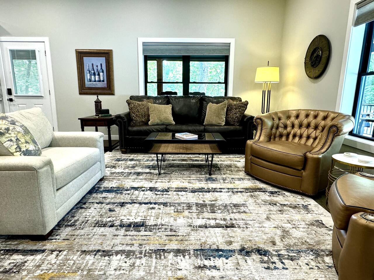 Spacious living room seating with real leather couch and chairs.