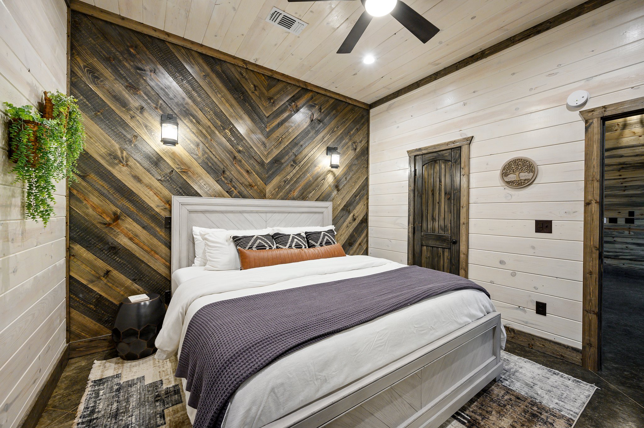 Modern rustic bliss: A designer bedroom with warm, natural timber tones.