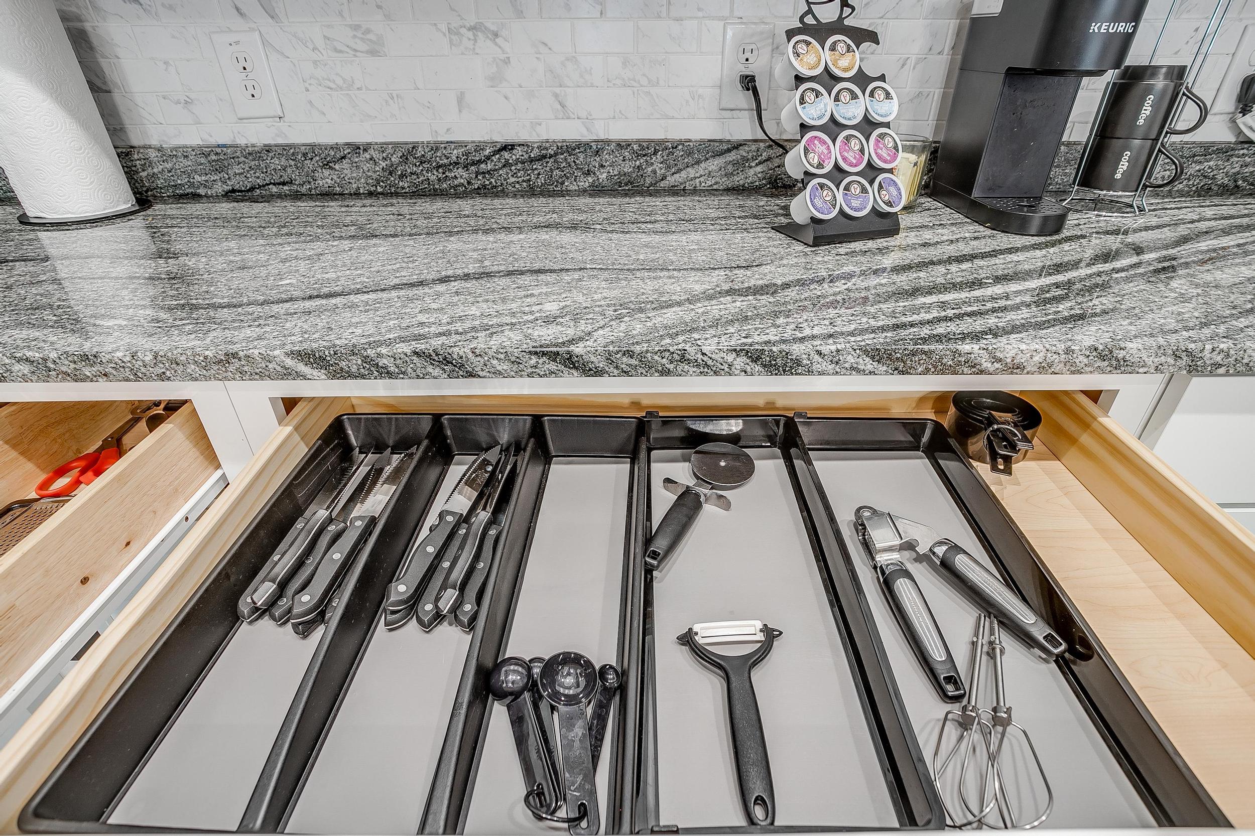 Drawer organized with all essential cooking tools.